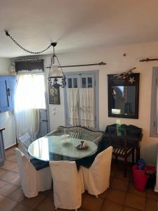 a kitchen and dining room with a table and chairs at Serifos house in Serifos Chora