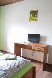 TV a/nebo společenská místnost v ubytování Pura Vida