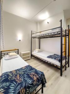Posteľ alebo postele v izbe v ubytovaní Arcus Premium Hostel
