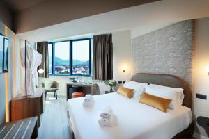 Postel nebo postele na pokoji v ubytování Tuscany Inn
