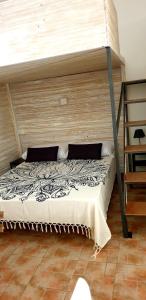 a bedroom with a bunk bed and a ladder at La Salitella in Terracina