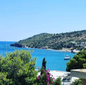a view of a body of water with a boat at Hotel Liberty 1 in Agia Marina Aegina