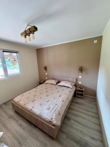 Giường trong phòng chung tại Casa Magda - Oaza de Relaxare
