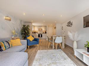 a living room with a couch and a table at 2 Bed in Westward Ho 65074 in Northam