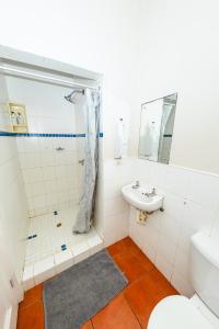 a bathroom with a shower and a sink at Forest Cottage in Pennington