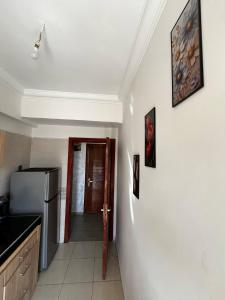 a kitchen with a refrigerator and a counter top at appartement Marrakech in Oulad Akkou +18 photos