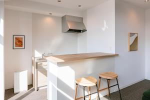 Kuchyň nebo kuchyňský kout v ubytování LUX by Hotel BAL