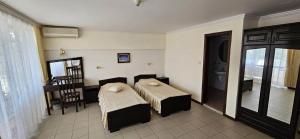 Postel nebo postele na pokoji v ubytování Hotel Klisura