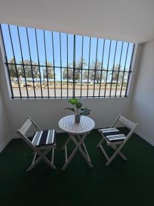 a room with a table and chairs and a window at Alicante 30 in Alicante