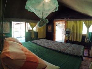 Postel nebo postele na pokoji v ubytování Jungle Cabin - Bundala