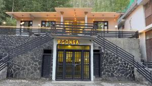 a building with a exorcosa sign above a door at RGONSA hotel in Skardu