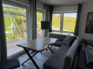 a living room with a couch and a coffee table at Eröffnungsangebot 100 qm Casa Daniela Donau Exclusive in Vilshofen an der Donau