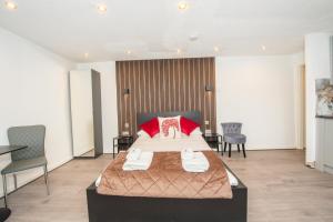 a hotel room with a bed and a table and chairs at The Moscow Studios in Liverpool +56 photos