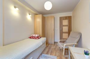 Postel nebo postele na pokoji v ubytování Apartament Brzeźno