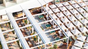 an overhead view of a building with people sitting at tables at Rixos Premium Dubrovnik in Dubrovnik