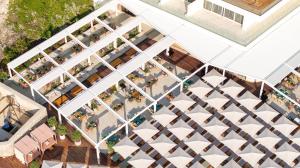 an overhead view of a building with tables and umbrellas at Rixos Premium Dubrovnik in Dubrovnik