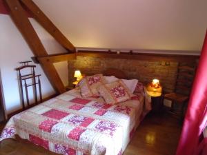 Postel nebo postele na pokoji v ubytování La Ferme aux Sangliers - Micalet