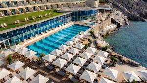 an aerial view of a resort with a swimming pool at Rixos Premium Dubrovnik in Dubrovnik