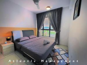 Postel nebo postele na pokoji v ubytování GAIA Residences Gamuda Garden + 11 fotografií