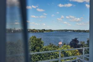a view of a river from a window at Hotel Atlantic Hamburg, Autograph Collection in Hamburg