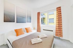 Ένα ή περισσότερα κρεβάτια σε δωμάτιο στο Lugano Oasis Apartment - Peaceful and Central
