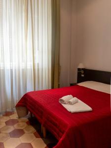 Postel nebo postele na pokoji v ubytování Sacro Cuore Hotel