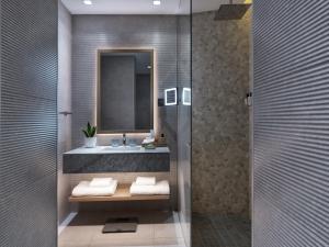 a bathroom with a sink and a mirror at The Chedi Luštica Bay in Tivat