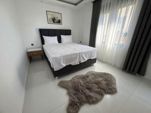 En eller flere senge i et værelse på Sweet Apartment + 18 billeder