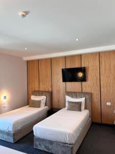 Postel nebo postele na pokoji v ubytování Hotel Delta Premium