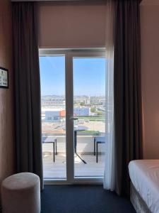Postel nebo postele na pokoji v ubytování Hotel Delta Premium