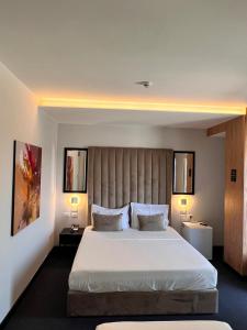Postel nebo postele na pokoji v ubytování Hotel Delta Premium