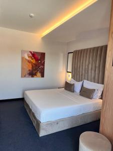Postel nebo postele na pokoji v ubytování Hotel Delta Premium