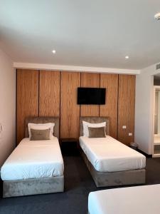 Postel nebo postele na pokoji v ubytování Hotel Delta Premium