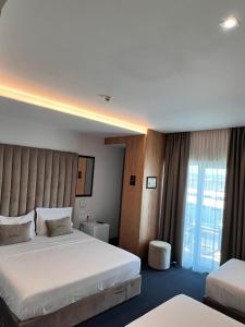 Postel nebo postele na pokoji v ubytování Hotel Delta Premium