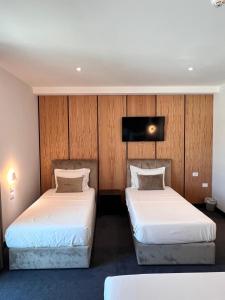 Postel nebo postele na pokoji v ubytování Hotel Delta Premium