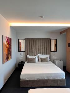 Postel nebo postele na pokoji v ubytování Hotel Delta Premium
