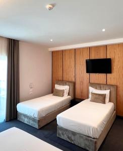 Postel nebo postele na pokoji v ubytování Hotel Delta Premium