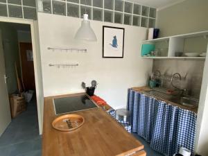 a kitchen with a sink and a counter top at Le lys d'or Piscine Plage Terrasse Wiffi in Juan-les-Pins