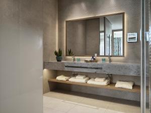 a bathroom with a sink and a mirror at The Chedi Luštica Bay in Tivat