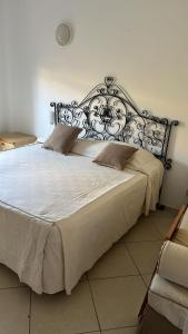 a bedroom with a large bed with white sheets at Serra Degli Alimini 2 in Alimini +92 photos