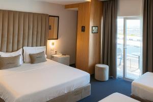 Postel nebo postele na pokoji v ubytování Hotel Delta Premium