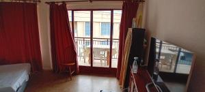 a room with a bed and a large window at Cryptocalp in Calpe