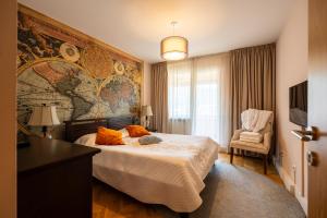a bedroom with a bed with a map on the wall at Top View Apartaments in Braşov