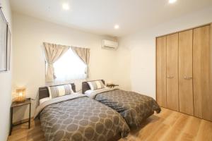 Letto o letti in una camera di ほんだけ