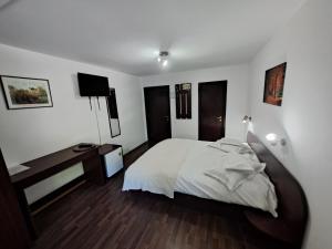 Postel nebo postele na pokoji v ubytování Moara Viselor