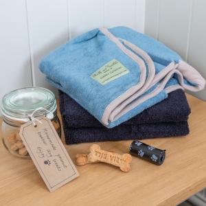 a pile of towels on a wooden table with a tag at THE VIEW, BROXA - Luxury Lodge - Yorkshire Coast in Scarborough +21 photos
