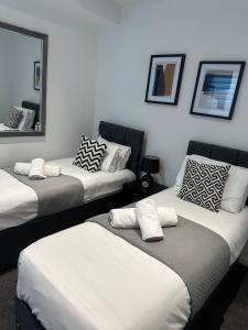 Voodi või voodid majutusasutuse Charming 3-Bedroom Watford Flat, Sleeps 8 - Market St toas