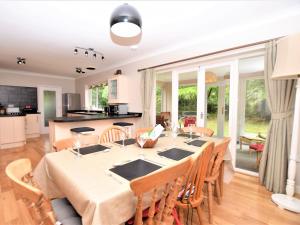 a kitchen and dining room with a table and chairs at 4 Bed in Cromer KT116 in Cromer +22 photos