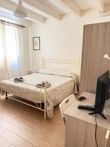 Postel nebo postele na pokoji v ubytování B&B Certe Notti