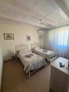 Postel nebo postele na pokoji v ubytování B&B Certe Notti